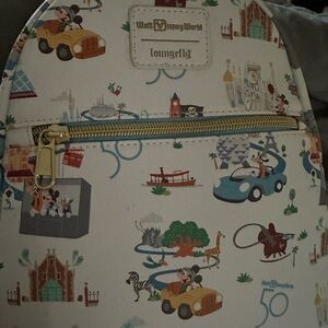 Walt Disney World 50th Anniversary backpack and matching wallet.
